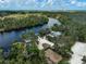Waterfront home featuring a private dock, sandy beach, and plenty of outdoor recreation at 15608 31St E St, Parrish, FL 34219