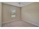 Neutral bedroom with carpet, window, and base trim at 15608 31St E St, Parrish, FL 34219