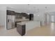Modern kitchen with stainless steel appliances, granite countertops, and a tiled backsplash at 15608 31St E St, Parrish, FL 34219