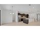 Modern kitchen with stainless steel appliances, dark wood cabinets, and a convenient breakfast bar at 15608 31St E St, Parrish, FL 34219