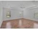 Spacious main bedroom with three windows and a ceiling fan provides natural light at 15608 31St E St, Parrish, FL 34219