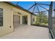 Covered patio with outdoor furniture, a ceiling fan, and a view of tropical landscaping at 15608 31St E St, Parrish, FL 34219