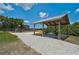 Community park featuring picnic tables under a sheltered structure, a playground, and walking paths at 15608 31St E St, Parrish, FL 34219