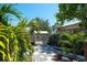 Well-maintained backyard featuring a shed and lush tropical landscaping at 1814 6Th W Ave, Bradenton, FL 34205
