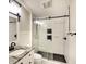 Modern bathroom with glass shower, stylish fixtures, and a contrasting dark stone floor for a sleek design at 1814 6Th W Ave, Bradenton, FL 34205