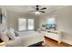 Cozy bedroom features hardwood floors, neutral walls, and a ceiling fan for added comfort at 1814 6Th W Ave, Bradenton, FL 34205