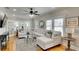 Bright living room featuring a comfortable sectional sofa, hardwood floors, and natural light at 1814 6Th W Ave, Bradenton, FL 34205