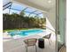 Screened in patio with pool views and patio furniture at 2246 Webber St, Sarasota, FL 34239