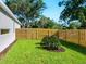 The backyard includes new sod and a freshly stained fence, perfect for outdoor activities at 2246 Webber St, Sarasota, FL 34239