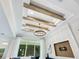 Decorative ceiling with beams and a modern chandelier at 2246 Webber St, Sarasota, FL 34239