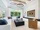 Spacious living room with coffered ceilings and oversized windows at 2246 Webber St, Sarasota, FL 34239