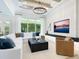 Spacious living room with coffered ceilings and oversized windows at 2246 Webber St, Sarasota, FL 34239