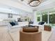Open concept living room with an eat in kitchen and hardwood floors at 2246 Webber St, Sarasota, FL 34239