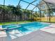 Screened in pool and spa with tile surround and privacy landscaping at 2246 Webber St, Sarasota, FL 34239