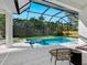A beautiful screened-in pool with an attached spa offers a relaxing outdoor retreat at 2246 Webber St, Sarasota, FL 34239