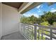 A balcony with decorative railings offers an outdoor view, enhancing the home's charm at 2590 Floyd St, Sarasota, FL 34239