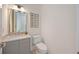 Stylish powder room with a marble countertop, modern fixtures, and decorative wall art at 2590 Floyd St, Sarasota, FL 34239