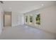 Spacious bonus room with large windows and recessed lighting perfect for customization at 2590 Floyd St, Sarasota, FL 34239