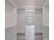Spacious closet with adjustable shelving, closet rods, and four drawers for optimized storage at 2590 Floyd St, Sarasota, FL 34239