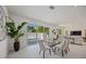 Elegant dining area with sliding glass doors leading to the pool area at 2590 Floyd St, Sarasota, FL 34239