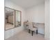 Elegant dressing area with dual mirrors, vanity, and a scenic view into the walk-in closet at 2590 Floyd St, Sarasota, FL 34239