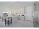 Modern kitchen with a waterfall island, stainless steel appliances, and bar seating at 2590 Floyd St, Sarasota, FL 34239