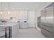 This kitchen features stainless steel appliances, modern cabinetry, and a large kitchen island at 2590 Floyd St, Sarasota, FL 34239