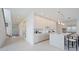 A modern kitchen featuring a large island, bar stool seating, and stainless steel appliances at 2590 Floyd St, Sarasota, FL 34239