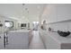 A modern kitchen featuring a large center island, bar stool seating, and modern cabinetry at 2590 Floyd St, Sarasota, FL 34239