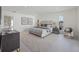Spacious main bedroom with large bed, stylish decor, and ample natural light for a serene retreat at 2590 Floyd St, Sarasota, FL 34239