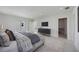 Inviting main bedroom with neutral tones, contemporary furniture, and open access to a dressing area at 2590 Floyd St, Sarasota, FL 34239