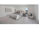 Well-lit main bedroom features a comfortable bed, soft textures, and view from the windows creating a tranquil atmosphere at 2590 Floyd St, Sarasota, FL 34239