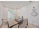 Bright home office featuring a modern desk, stylish seating, and contemporary decor at 2590 Floyd St, Sarasota, FL 34239