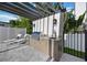 Outdoor kitchen featuring a stainless steel grill, sink, cabinets, and pergola at 2590 Floyd St, Sarasota, FL 34239