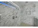 Modern shower featuring stylish marble tile and multiple shower heads at 2590 Floyd St, Sarasota, FL 34239