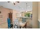 Bright dining area featuring a unique table with colorful chairs and breakfast bar, with modern lighting at 27243 Ipswich Dr, Englewood, FL 34223
