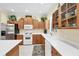 Modern kitchen featuring stainless steel appliances, light wood cabinetry, and bright white countertops at 2871 Phoenix Palm Ter, North Port, FL 34288