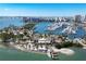 Breathtaking aerial view of waterfront marina, a small island, and skyline in the distance at 300 S Pineapple Ave # 302, Sarasota, FL 34236