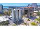 Aerial view of a modern, white condo building showcasing its surrounding urban landscape at 300 S Pineapple Ave # 302, Sarasota, FL 34236