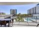 Enjoy pool views from this relaxing balcony at 300 S Pineapple Ave # 302, Sarasota, FL 34236