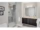Modern bathroom features a glass-enclosed shower and sleek vanity at 300 S Pineapple Ave # 302, Sarasota, FL 34236