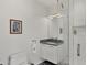 Modern bathroom with sleek vanity, frameless glass shower, and elegant fixtures at 300 S Pineapple Ave # 302, Sarasota, FL 34236