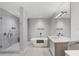 Modern bathroom with a glass-enclosed shower, soaking tub, and contemporary vanity at 300 S Pineapple Ave # 302, Sarasota, FL 34236