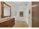 Inviting entryway with a chic wooden console table, mirror and modern decor at 300 S Pineapple Ave # 302, Sarasota, FL 34236