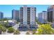Modern, white high-rise condo building featuring balconies and floor-to-ceiling windows at 300 S Pineapple Ave # 302, Sarasota, FL 34236