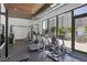 Modern gym featuring treadmills and weight equipment with views of the pool area at 300 S Pineapple Ave # 302, Sarasota, FL 34236