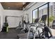 Bright gym with treadmills, weights and exercise equipment with a glimpse of the outside at 300 S Pineapple Ave # 302, Sarasota, FL 34236