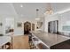 Spacious kitchen with a large island, modern lighting, and stainless steel appliances at 300 S Pineapple Ave # 302, Sarasota, FL 34236