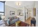 Bright living room featuring a comfortable sofa, area rug, and stylish decor at 300 S Pineapple Ave # 302, Sarasota, FL 34236