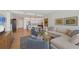 Open concept living room with wood floors, modern furnishings, and an airy layout at 300 S Pineapple Ave # 302, Sarasota, FL 34236
